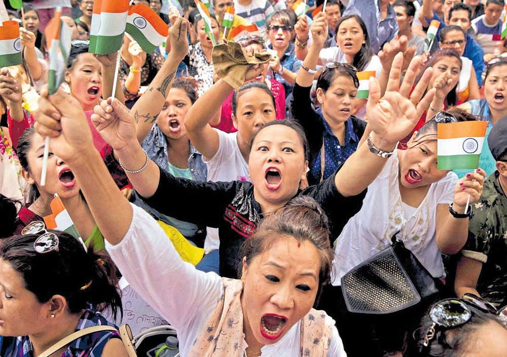 Protesters demanding the creation of a separate state of Gorkhaland, shout slogans at a protest in New Delhi on Sunday. They also demanded immediate removal of paramilitary forces from the Darjeeling hills. pti
