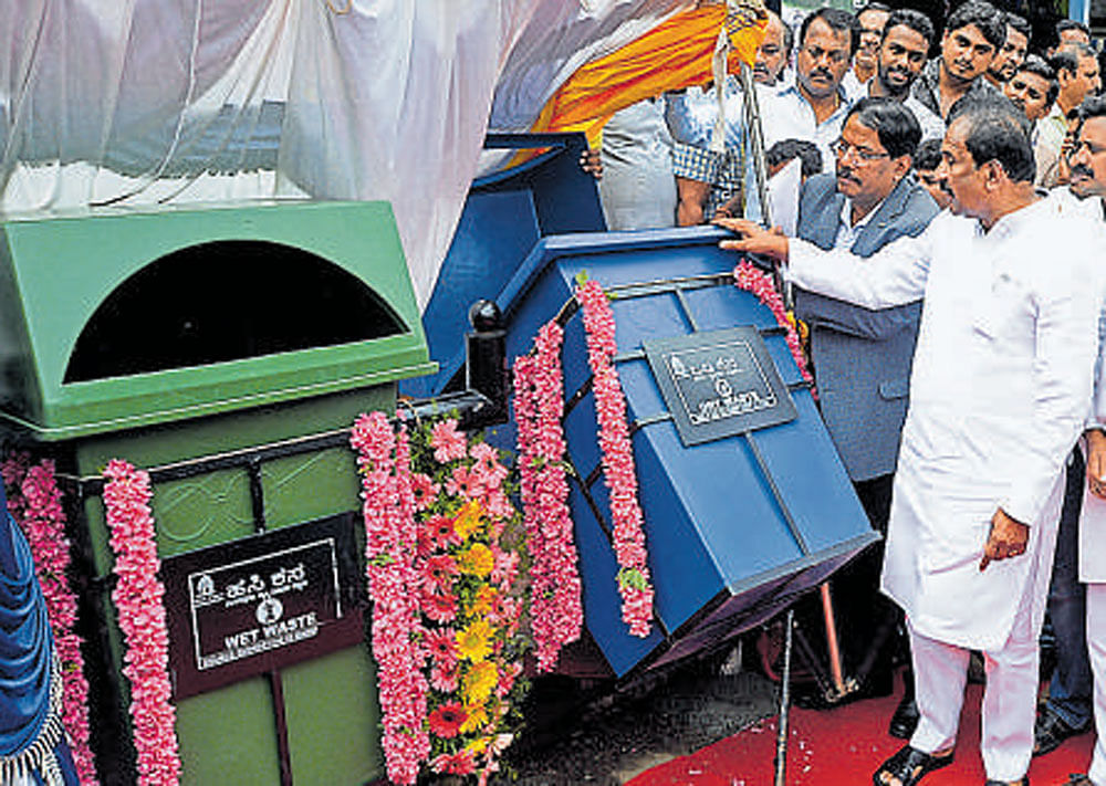 Bengaluru Development  Minister K J George inaugurates twin dustbins at Gandhi Nagar on Monday.
