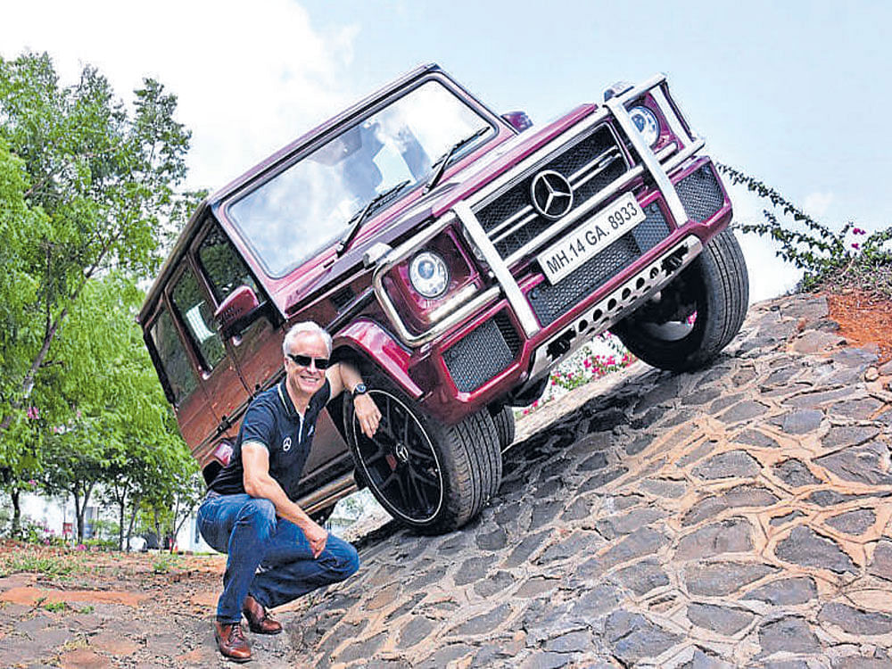 Roland Folger poses with the imposing Mercedes-AMG G 63 'Edition 463'.