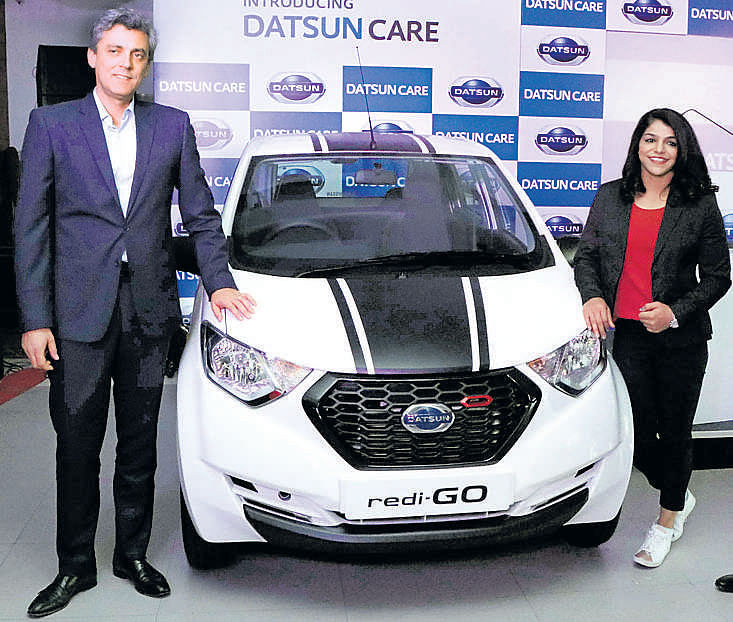 Datsun India Vice President Jerome Saigot with Olympian wrestler Sakshi Malik at the launch of Datsun CARE.