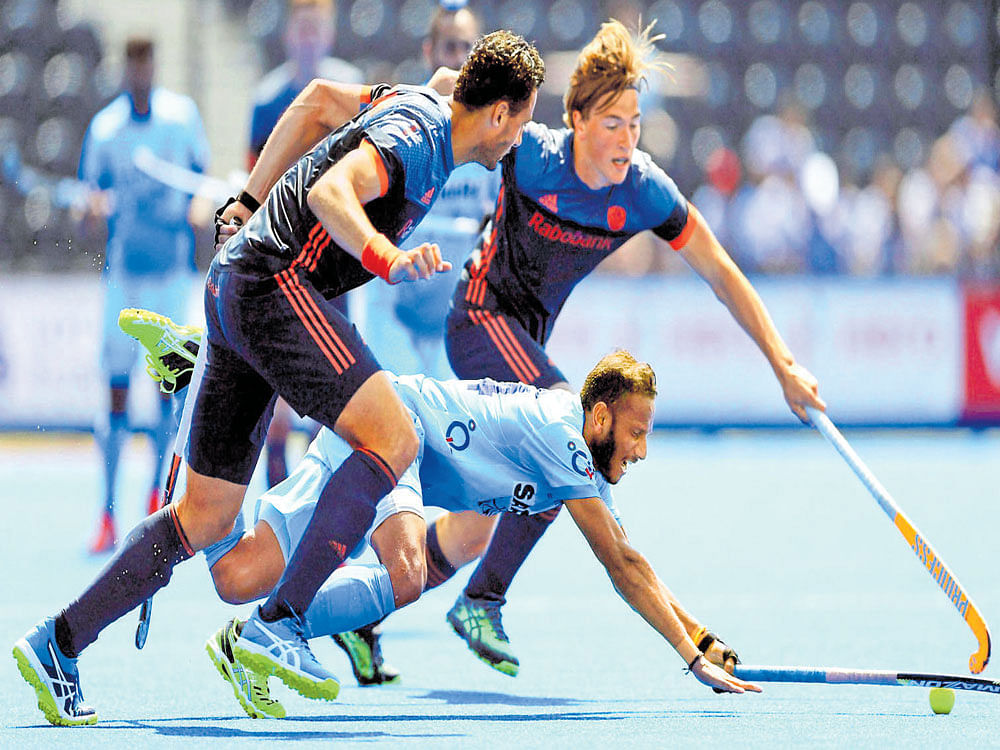 no way out: India's SV&#8200;Sunil tries to get past the Netherlands defence during their Hockey World League Semifinals tie in London on&#8200;Tuesday. PTI Photo