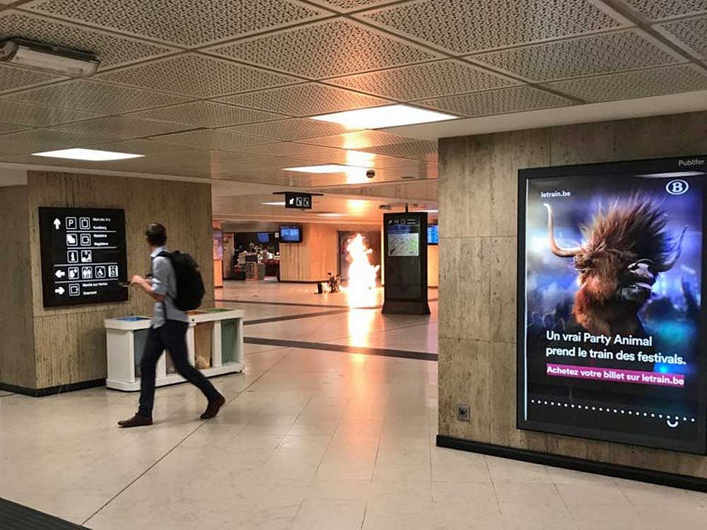 Fire is seen at Brussels central station in Brussels, Belgium June 20, 2017. Courtesy Twitter/@remybonnaffe/via REUTERS