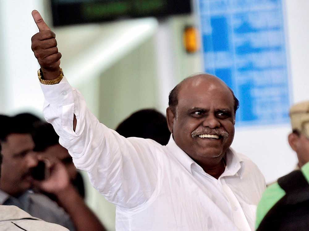 Former Kolkata High Court Judgec Justice CS Karnan being taken by West Bengal police to that city at the airport in Chennai on Wednesday. He was arrested yesterday night from Coimbatore. PTI Photo