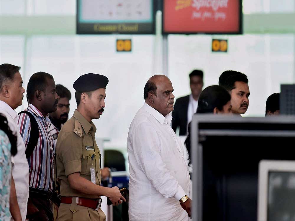 Former Calcutta High Court judge C S Karnan at the airport in Chennai while he was being taken to Kolkata by a team of West Bengal Police on Wednesday. Karnan was arrested from Coimbatore on Tuesday, more than a month after the Supreme Court sentenced him for contempt of court. PTI Photo