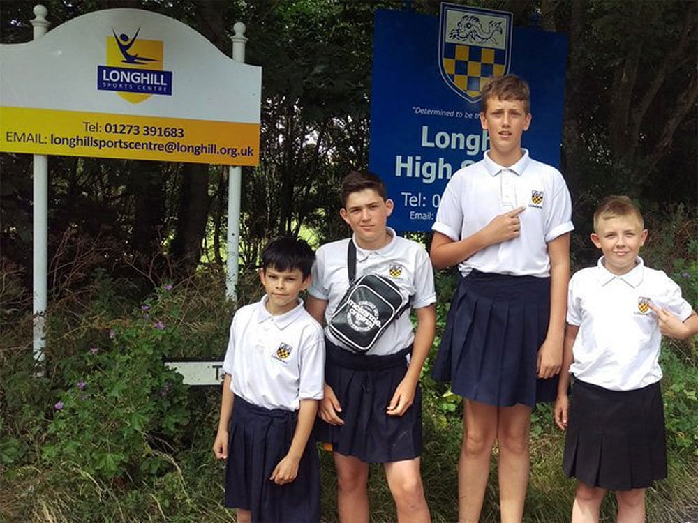 A group of boys in a UK school decided to protest the ban on shorts despite the ongoing heatwave by wearking skirts to class. Photo credit: twitter.