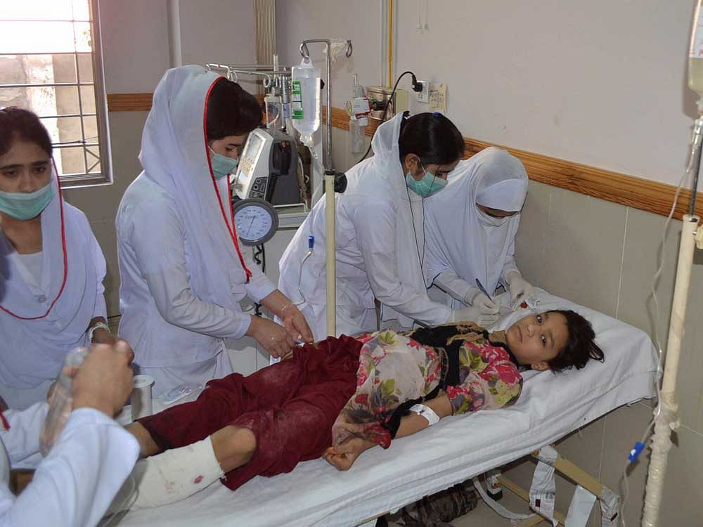 Pakistani nursing staff attend an injured girl at a hospital in Quetta, Pakistan, Friday, June 23, 2017. A powerful bomb went off near the office of the provincial police chief in southwest Pakistan on Friday, causing casualties, police said. AP/PTI Photo
