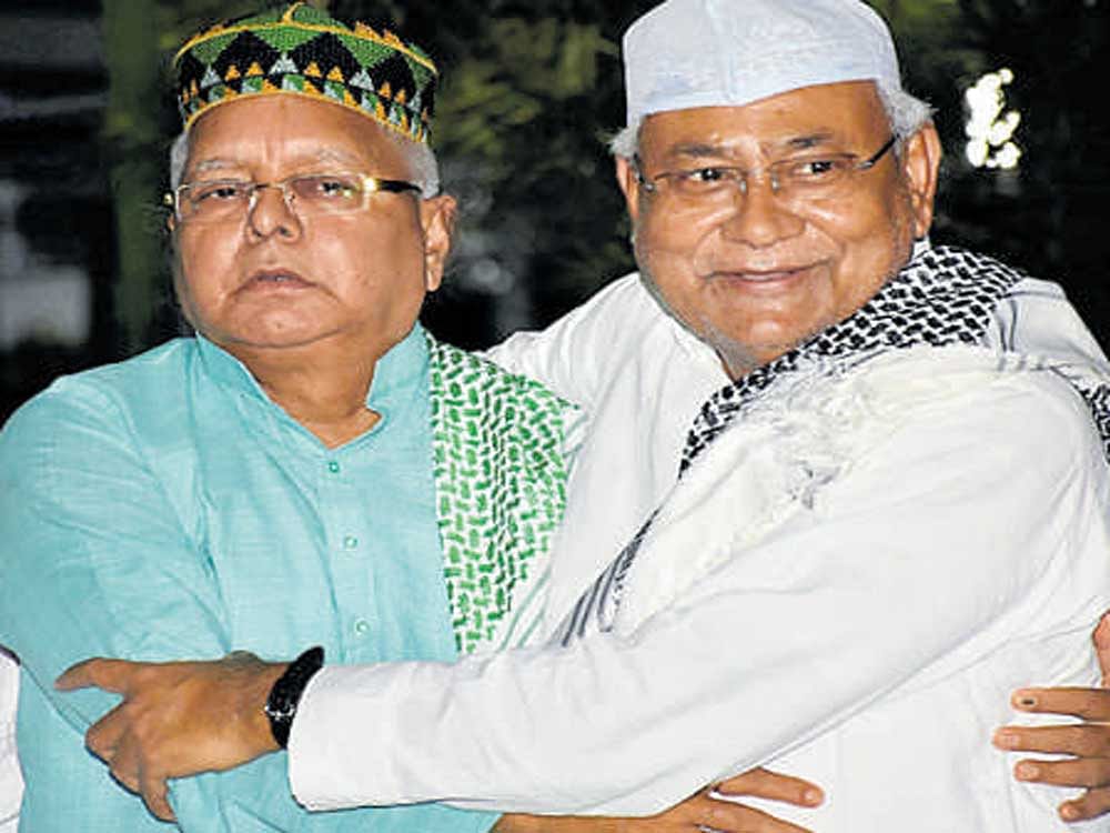 RJD president Lalu Prasad and Chief Minister Nitish  Kumar at an Iftar party in Patna on Friday. PTI