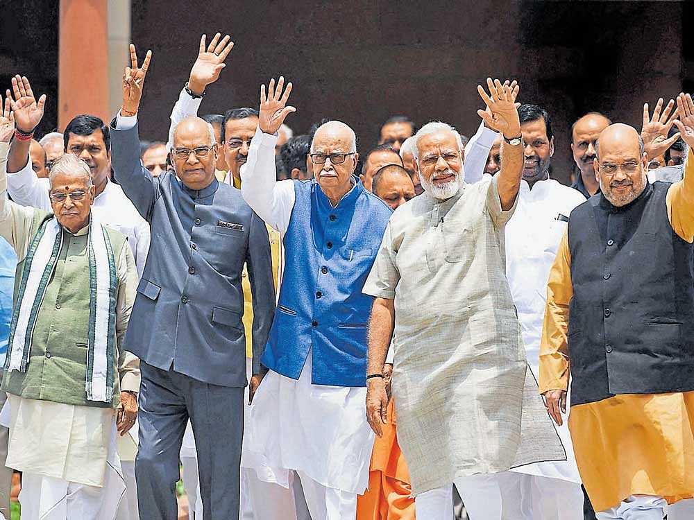 NDA Presidential nominee Ram Nath Kovind, flanked by Prime Minister Narendra Modi,  BJP chief Amit Shah,  senior leader  L K Advani and other NDA leaders, proceeds to file his nomination papers at Parliament in New Delhi on Friday. Pti
