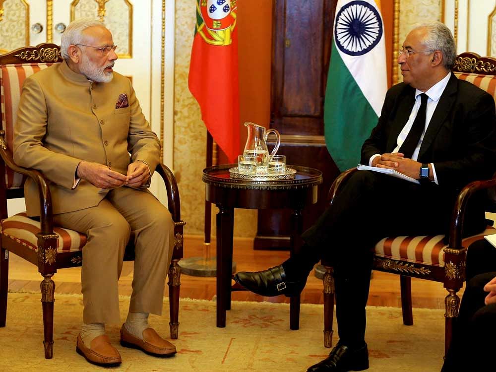 Portuguese Prime Minister Antonio Costa today sprang a surprise for Narendra Modi when he hosted a special Gujarati vegetarian lunch for him. AP/PTI Photo