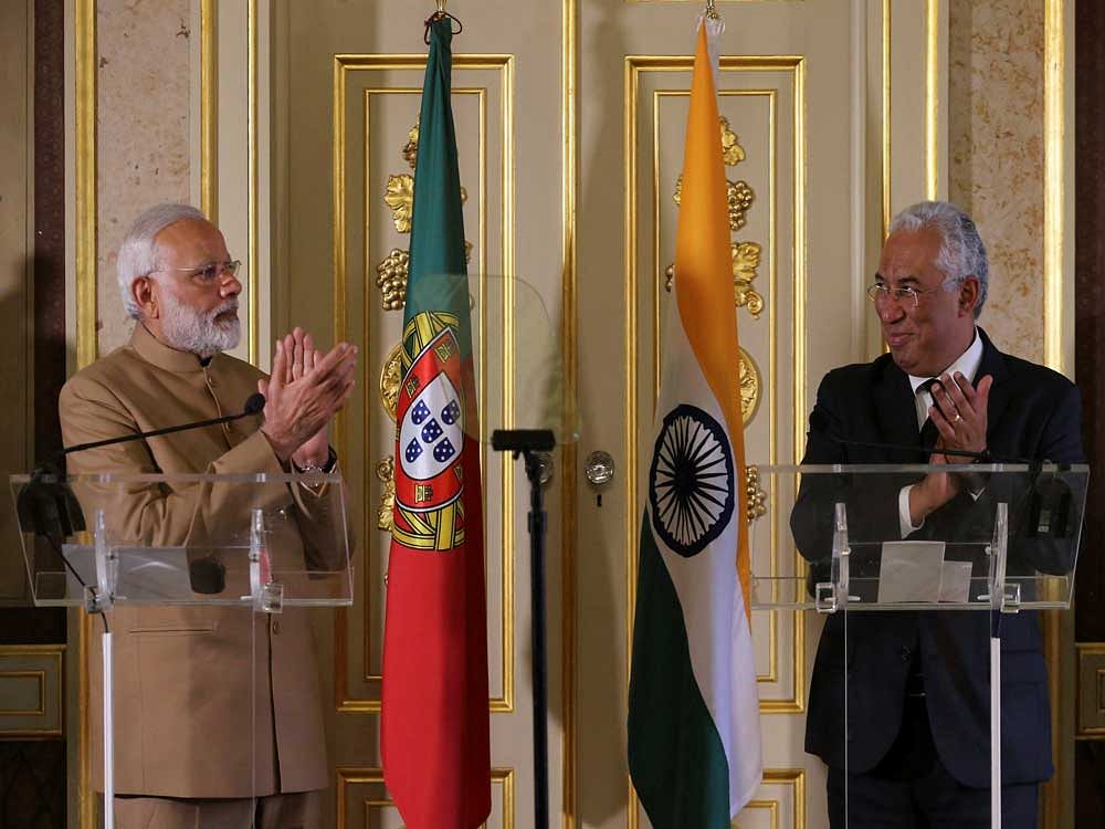 India's Prime Minister Narendra Modi, left and Portuguese Prime Minister Antonio Costa applaud each other after a joint statement at the Necessidades Palace, the Portuguese Foreign Ministry in Lisbon, Portugal, Saturday June 24, 2017. Modi is on a one day visit to Portugal.AP/PTI