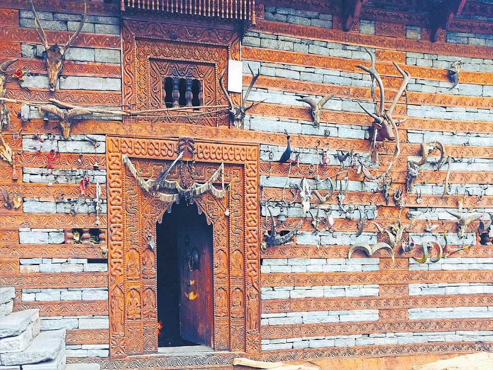 The facade of Jamlu Temple in Malana displaysdeer and goat skulls.