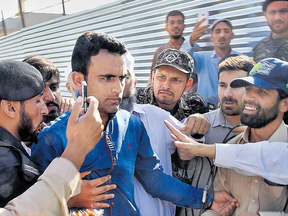 Pakistan's Fakhar Zaman (centre) was an instant hit among the fans after his return from the  Champions Trophy in England. Pakistan beat arch-rivals India in the final to lift their maiden title. afp