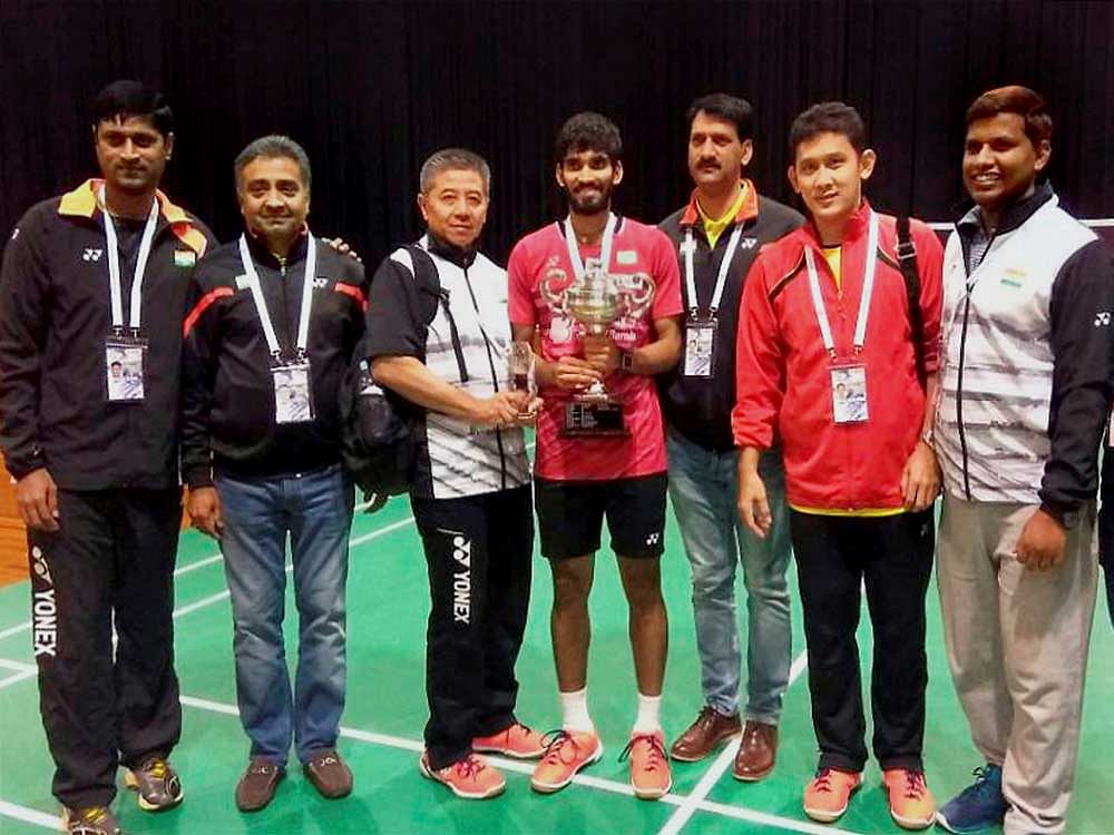 Indian shuttler Kidambi Srikanth along with the team management after winning the Australian Open summit clash in Sydney on Sunday. The Badminton Association of India (BAI) has announced a cash reward of Rs five lakh for Srikanth for his scintillating performance in Australia. PTI Photo