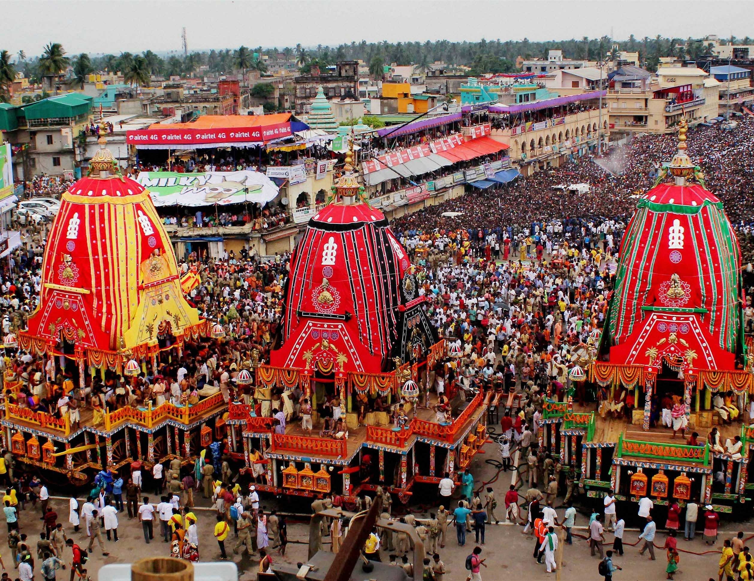 Lakhs of devotees take part in the Lord Jagannath annual Rath Yatra in Puri on Sunday. PTI Photo