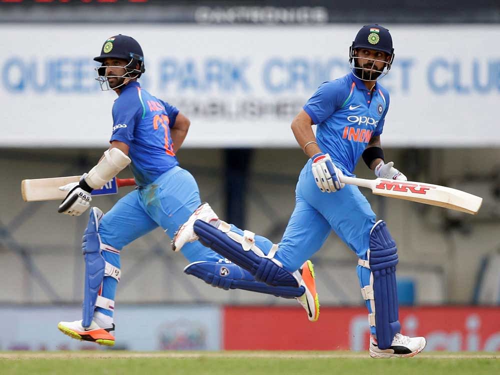 India's captain Virat Kohli, right, and Ajinka Rahane build up their partnership during the second ODI cricket match against West Indies at Queen's Park Oval in Port of Spain, Trinidad and Tobago, Sunday. AP/PTI