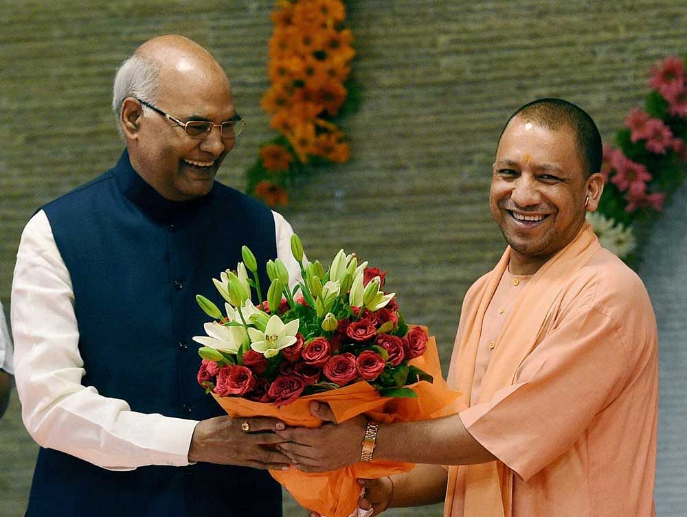 NDA presidential candidate Ram Nath Kovind being greeted by Uttar Pradesh Chief Minister Yogi Adityanath at his official residence in Lucknow on Sunday. PTI Photo