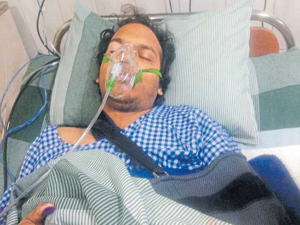 providential escape:  Mudit Dandwate being treated at Hosmat Hospital after he suffered injuries on his left arm  following a crocodile attack at a water body near Kanive  Mahadeswara temple on Harohalli-Thattakere Road on the outskirts of city on Sunday. dh Photo