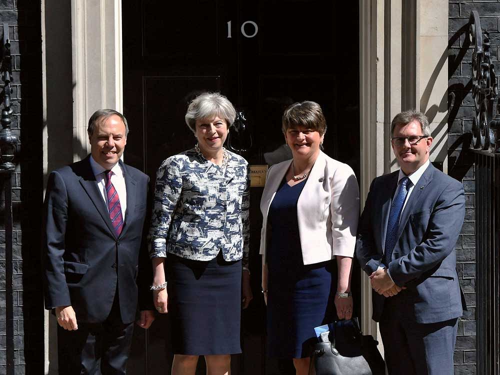 May's Tories strikes 1 bn pound power deal with N Ireland's DUP