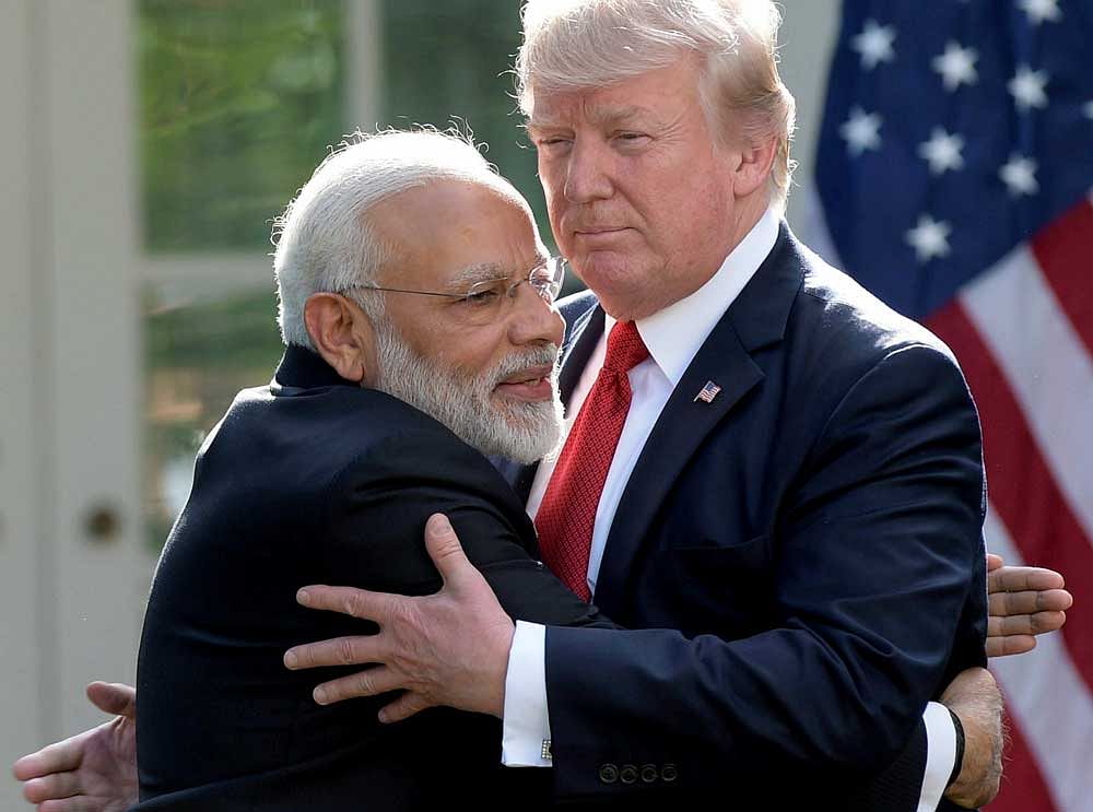 President Donald Trump and Indian Prime Minister Narendra Modi hug while making statements in the Rose Garden of the White House in Washington, Monday, June 26, 2017. AP/PTI