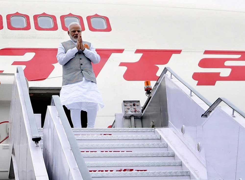 Prime Minister Narendra Modi on his arrival after a successful visit to Portugal, USA and Netherlands, at AFS Palam in New Delhi on Wednesday. PTI Photo /PIB