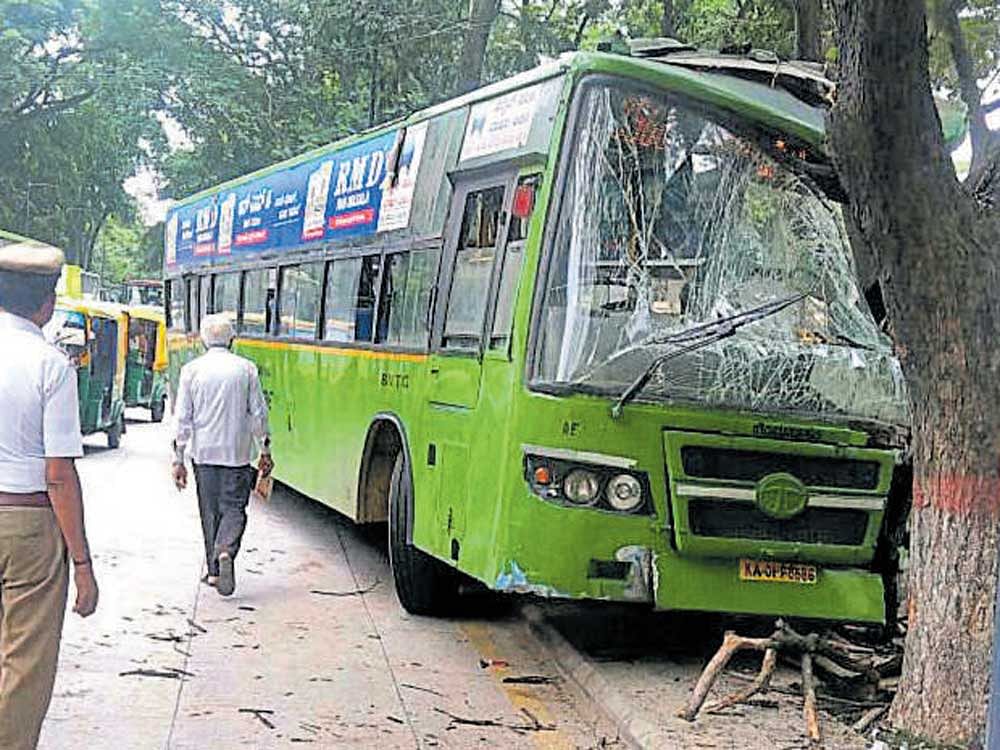 A BMTC bus heading towards Shantinagar depot from Majestic hit a tree on the roadside before coming to a halt. DH PHOTO