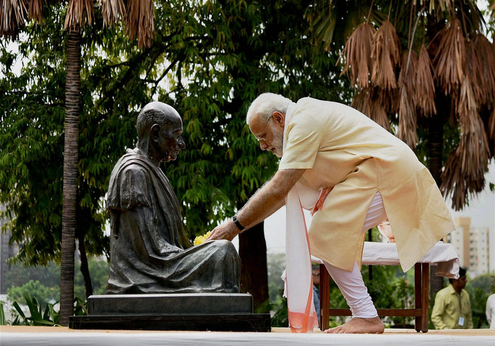 Narendra Modi visited the Sabarmati Ashram and paid his respects to the Mahatma. Photo credit: PTI.