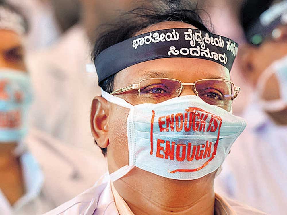 A file picture of the doctors and healthcare professionals from across Karnataka protesting against the proposed amendments to the KPME Act, 2017, at the Freedom Park in Bengaluru.