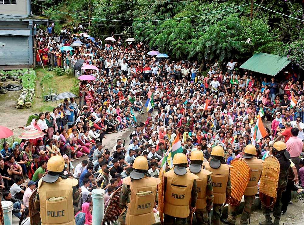 GJM supporters take out a mass rally to demand for separate state 'Gorkhaland' during a protest in Mirik near Darjeeling on Monday. PTI Photo