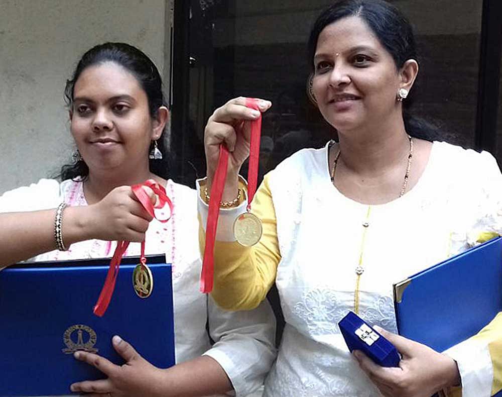 Priyanka Gupta who bagged a gold medal in Instrumentation and Applied Physics in MTech and Shilpa Dilip Kumar who  secured a medal in PhD Instrumentation and Applied Physics pose for a photograph at the IISc convocation. DH photo