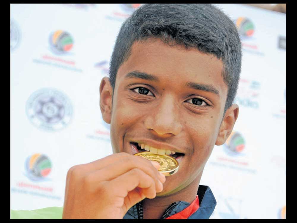 Karnataka's Tanish Mathew set a new meet record to clinch the boys' Group II 100M butterfly gold.