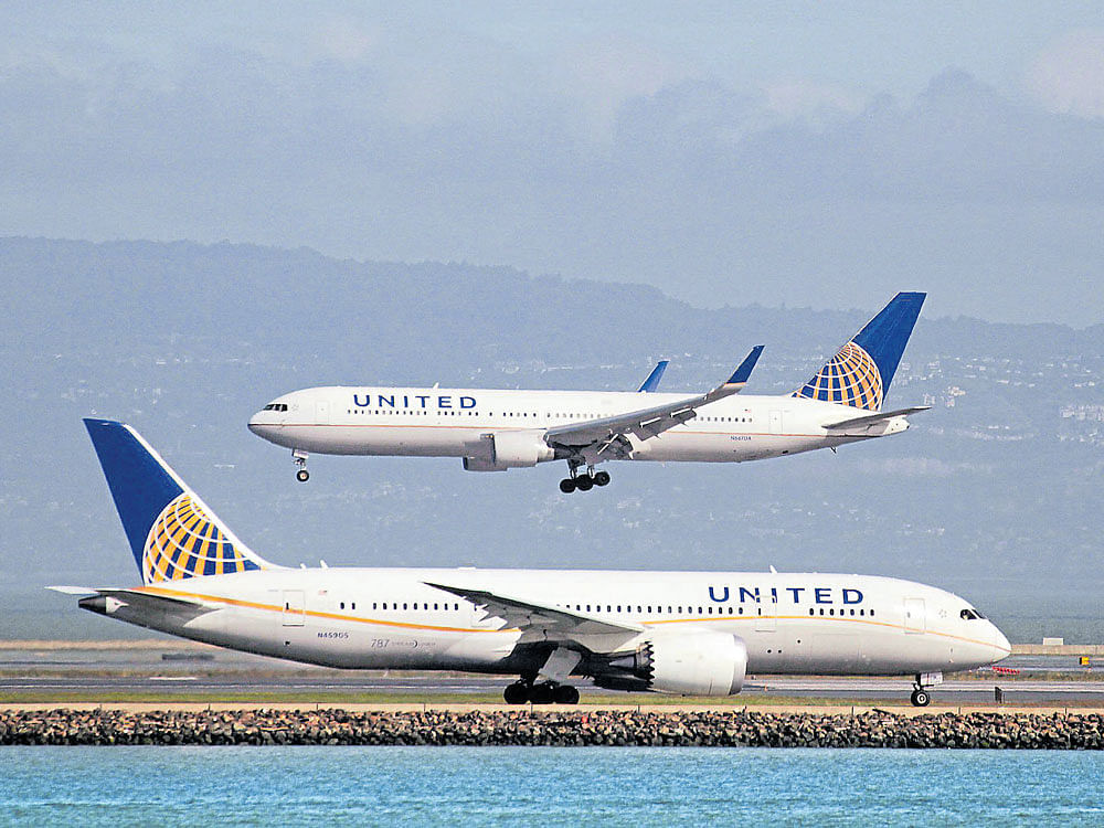 United Airlines reappeared in controversy, this time for forcing a woman to hold her toddler in her lap for three hours. Photo credit: reuters.