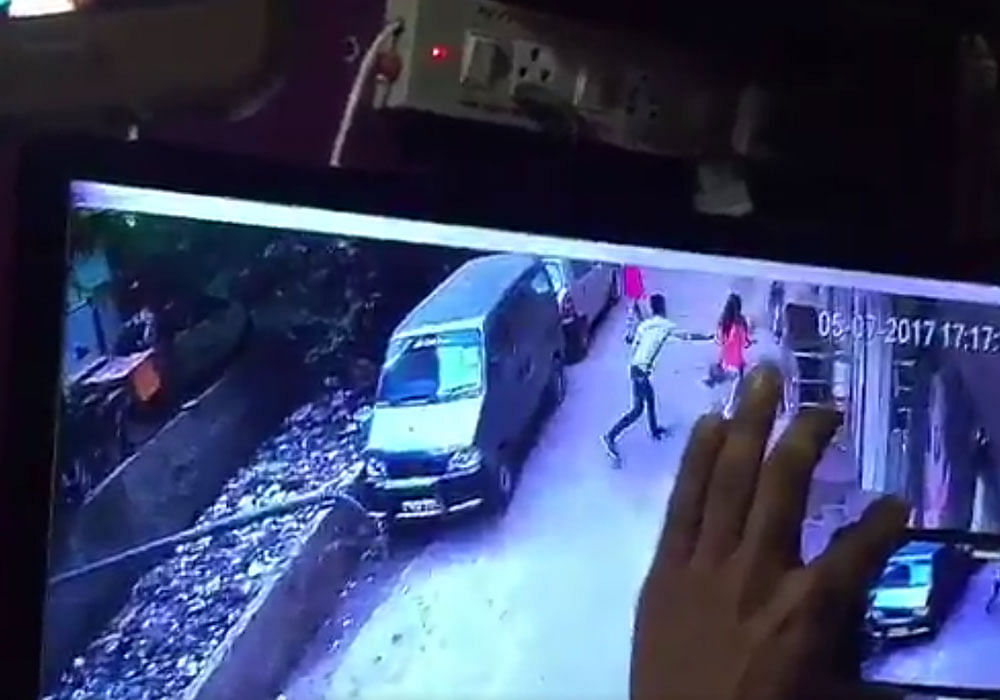 A CCTV grab (above) of the incident shows the accused attacking the woman and she running away from him. After some time, the accused can be seen fleeing from the spot, a police official said.