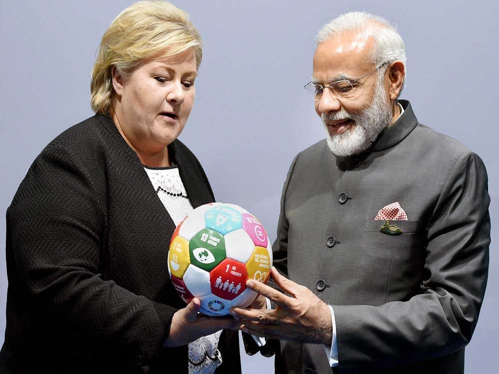 PM Modi today invited Norwegian pension funds to invest in the National Investment and Infrastructure Fund as he met Norway's Prime Minister Erna Solberg, who gifted him a symbolic football. AP, PTI Photo