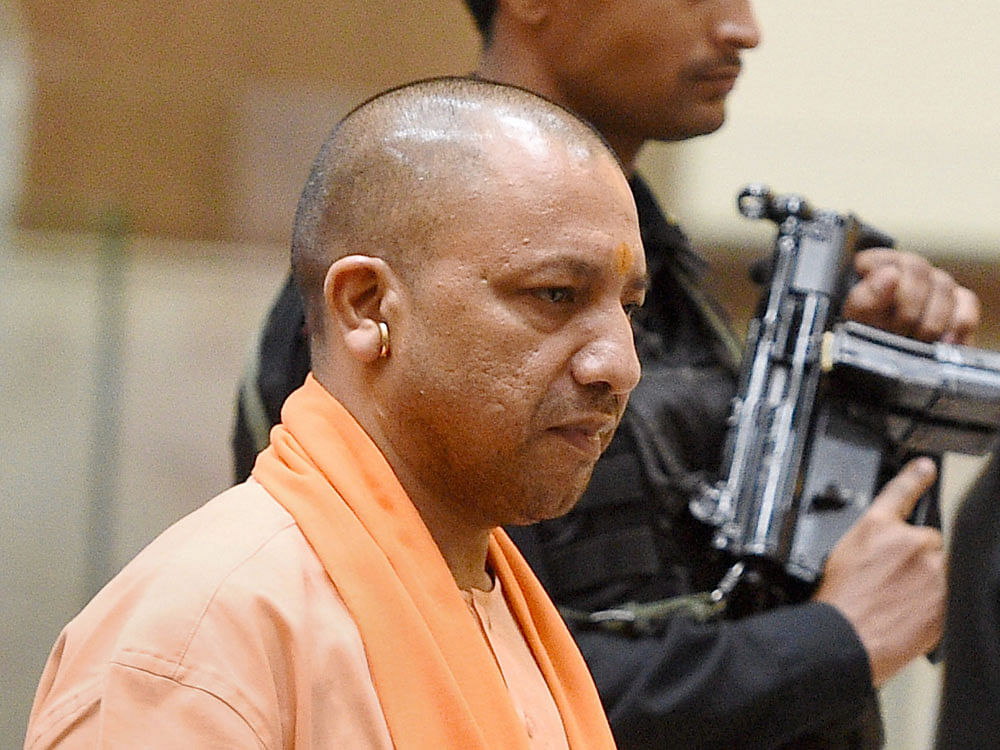 Sources said that a large crowd had gathered at the Temple, where Adityanath was holding the 'janata darbar'. People jostled with each other in a bid to hand over their applications to the chief minister. PTI file photo.