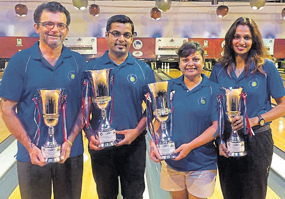Laurels (From left) Vijay Punjabi (runner-up, men), Akaash AK (champ, men), Judy Alban (champ, women) and Chethana Rajshekar (runner-up, women) with their spoils.