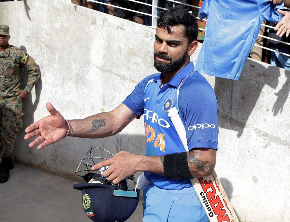 India's captain Virat Kohli leaves the field after his team defeated West Indies for 8 wickets during their fifth ODI at the Sabina Park cricket ground in Kingston, Jamaica, Thursday, July 6, 2017. India won the series 3-1. AP/PTI