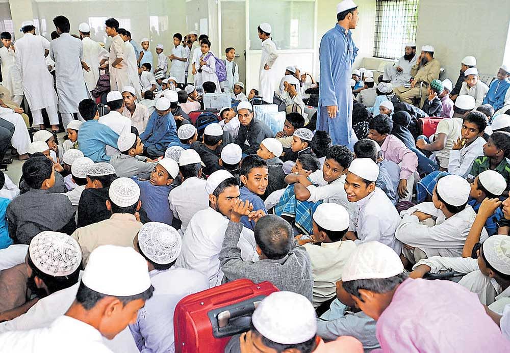 Madrasa students in the waiting room of Bengaluru Cantonment railway station on Tuesday. DH PHOTO/Ranju P
