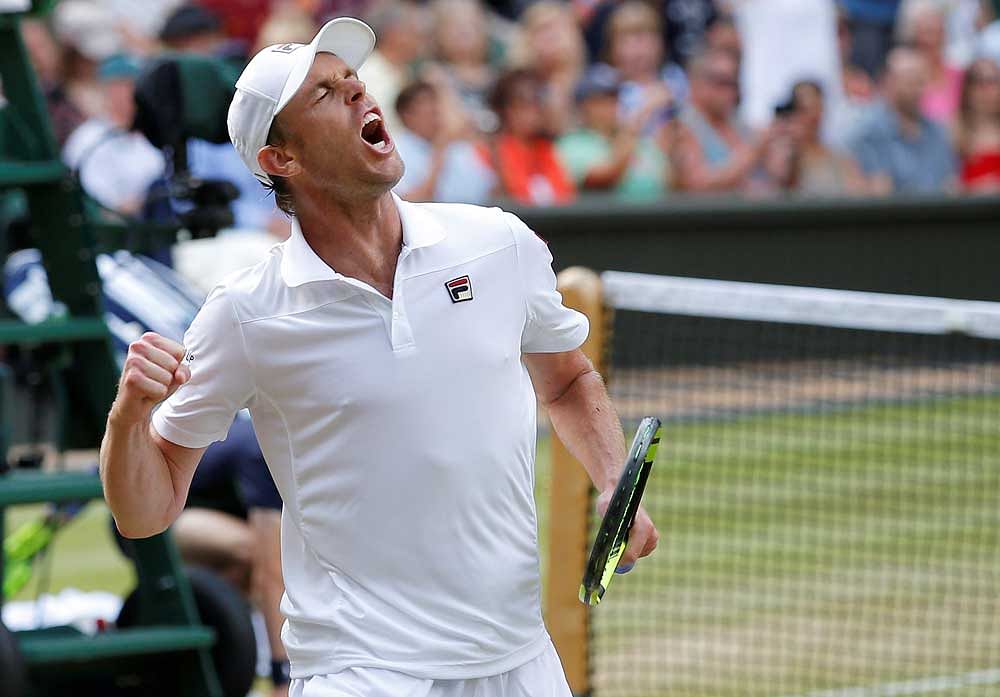 Sam Querrey of the U.S. celebrates winning the quarter final match against Great Britain's Andy Murray.  REUTERS
