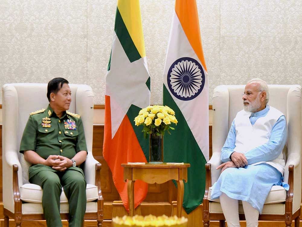 Prime Minister Narendra Modi with Commander-in-Chief of the Myanmar Defence Services, Sr. Gen. U Min Aung Hliang , in New Delhi on Friday. PTI Photo
