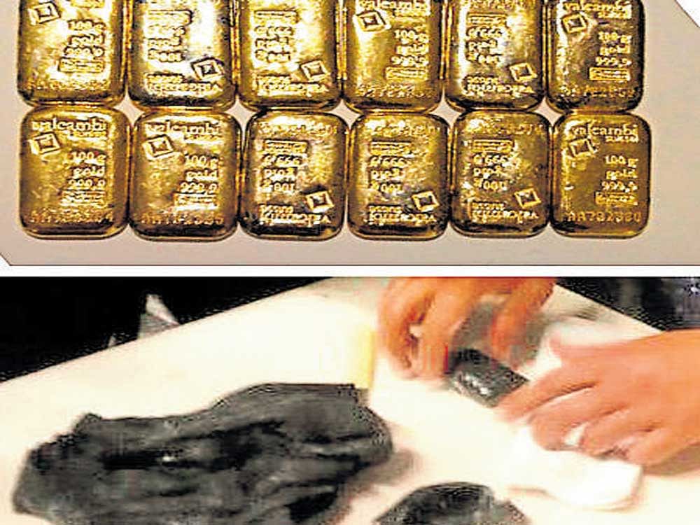 Gold bars wrapped in black insulating material concealed in underwears at KIA.