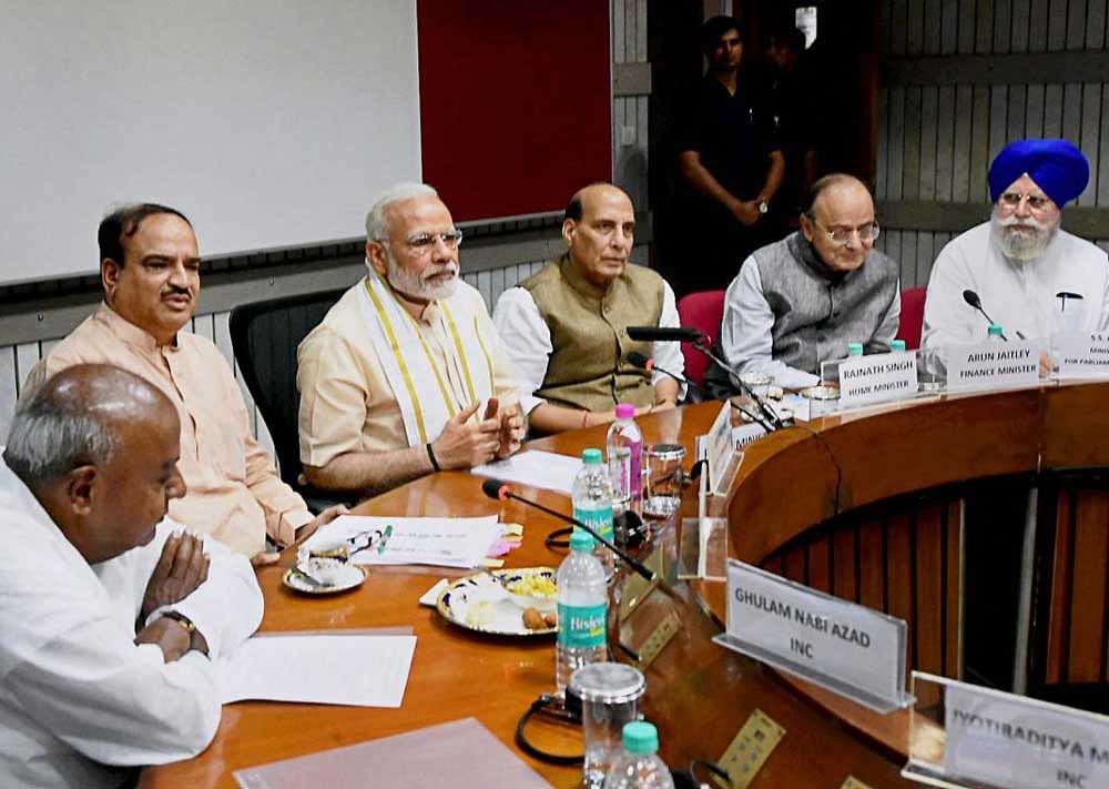 Prime Minister Narendra Modi, Home Minister Rajnath Singh, Finance Minister Arun Jaitley, Parliamentary Affairs Ministers Ananth Kumar and SS Ahluwalia with Former Prime Minister and JD(S) President H. D. Deve Gowda during an all-party meeting ahead of monsoon session of Parliament, in New Delhi on Sunday. PTI Photo