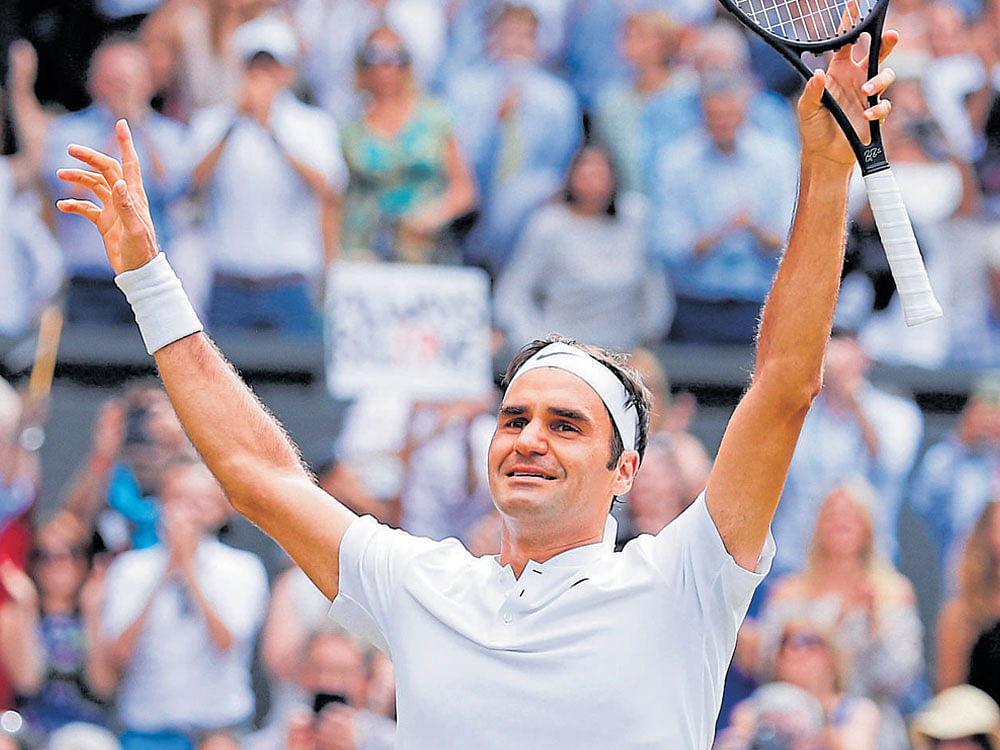 Roger Federer celebrates after defeating Marin Cilic to win his eighth Wimbledon singles title. Reuters