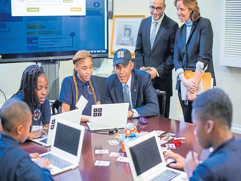 Barack Obama and co-founder of Code.org Hadi Partovi (behindObama) with a group of middle-schoolers for an Hour of Code event in 2014. Code.org's influence raises the question whether Silicon Valley is swaying public schools to serve its own interests. NYT