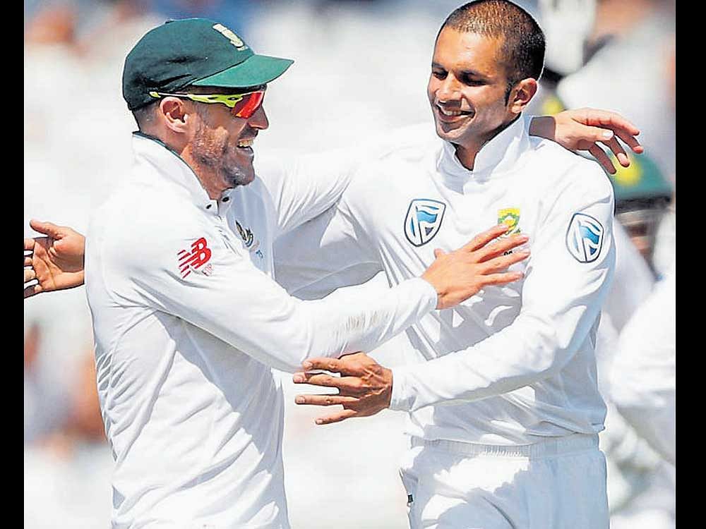 ON A ROLL South Africa's Keshav Maharaj (right) celebrates with Faf du Plessis after dismissing Jonny Bairstow. Reuters