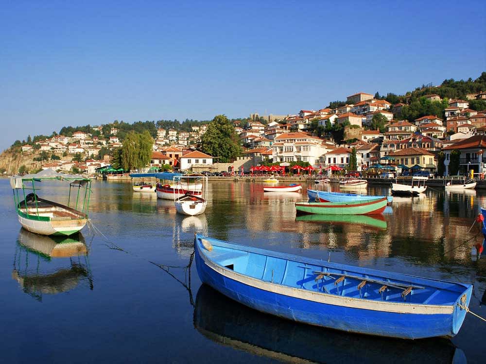 Fishing boats with the view of an old town of Ohrid in the background