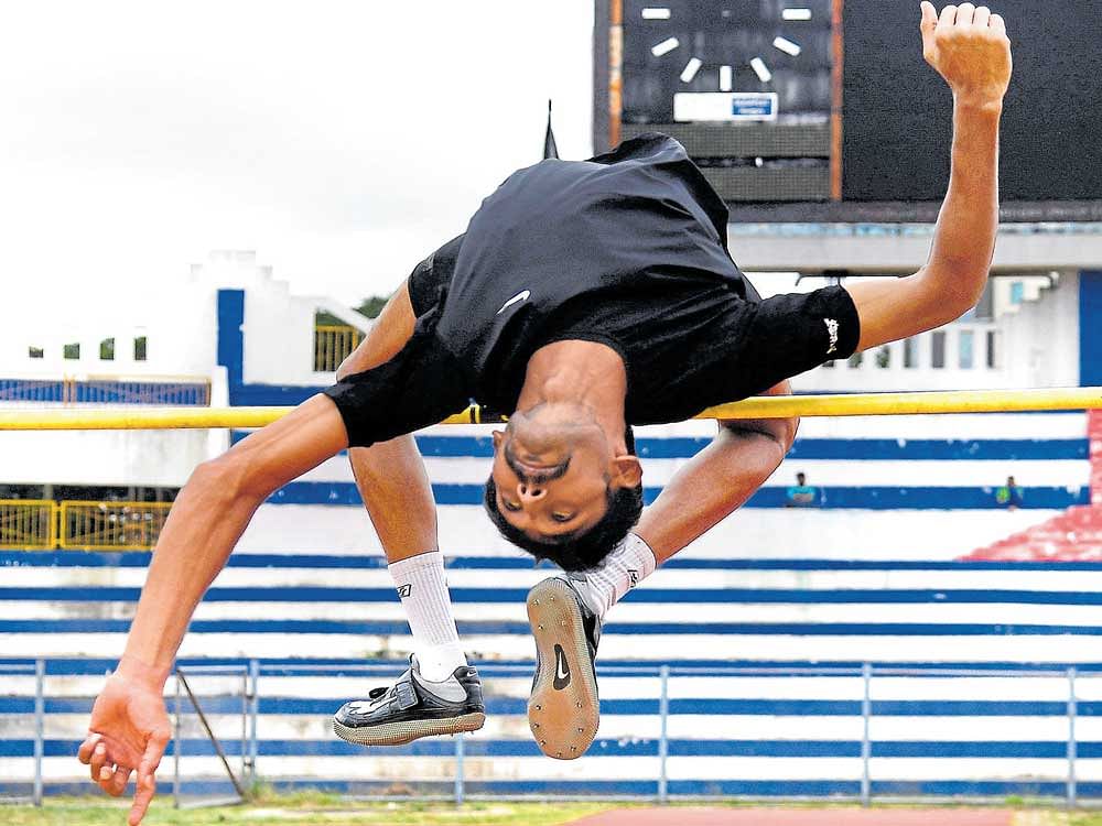 full of confidence Karnataka high jumper Chethan B has bounced back from a career-threatening back injury to bag the Federation Cup gold. At the recently held Asian meet, he equalled his personal best leap of 2.20m. DH photo/ KISHOR KUMAR BOLAR
