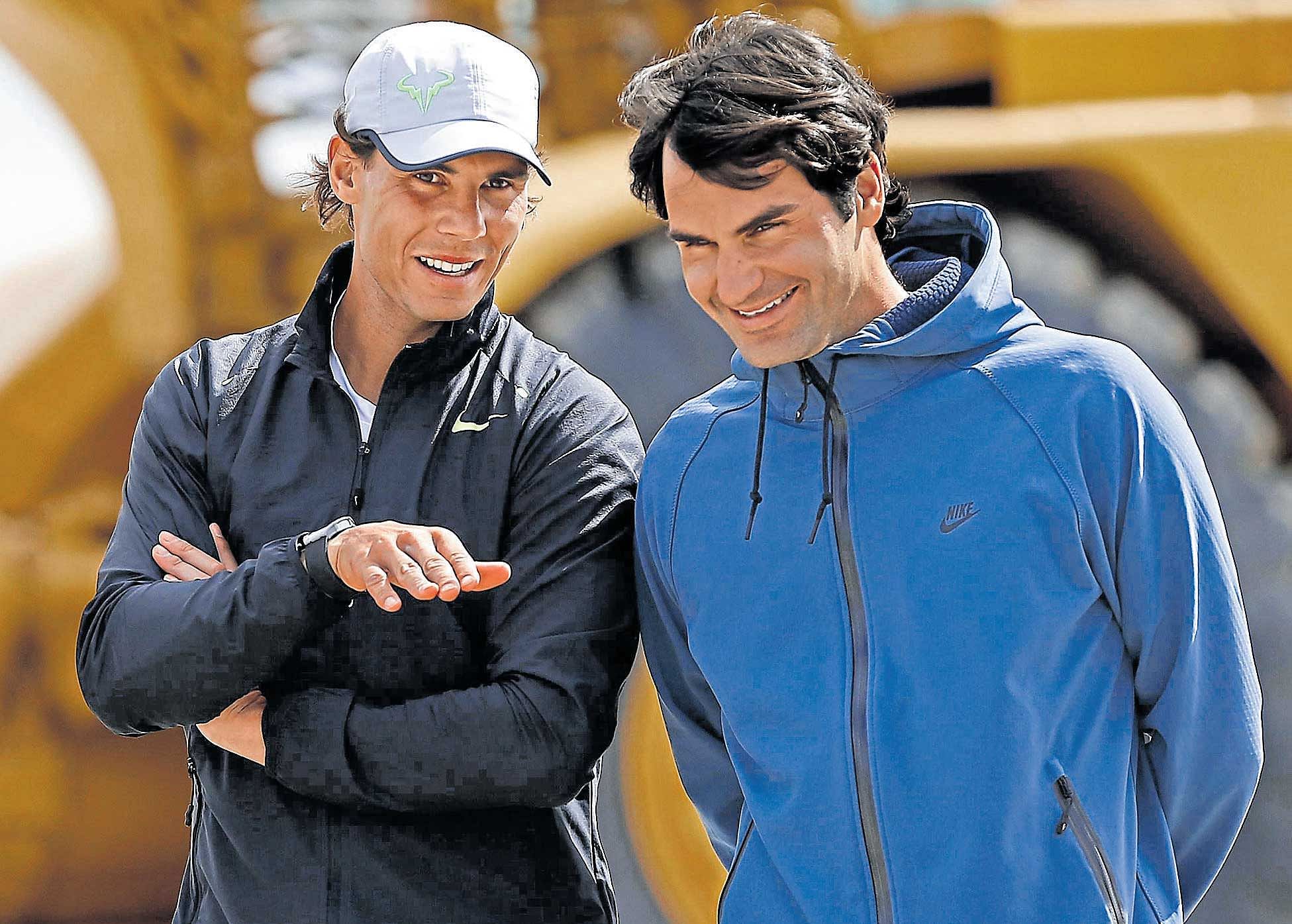 back to their best: Roger Federer (right) or Rafael Nadal -- both in menacing form -- could reclaim the coveted No 1 ranking by the end of the year. file photo