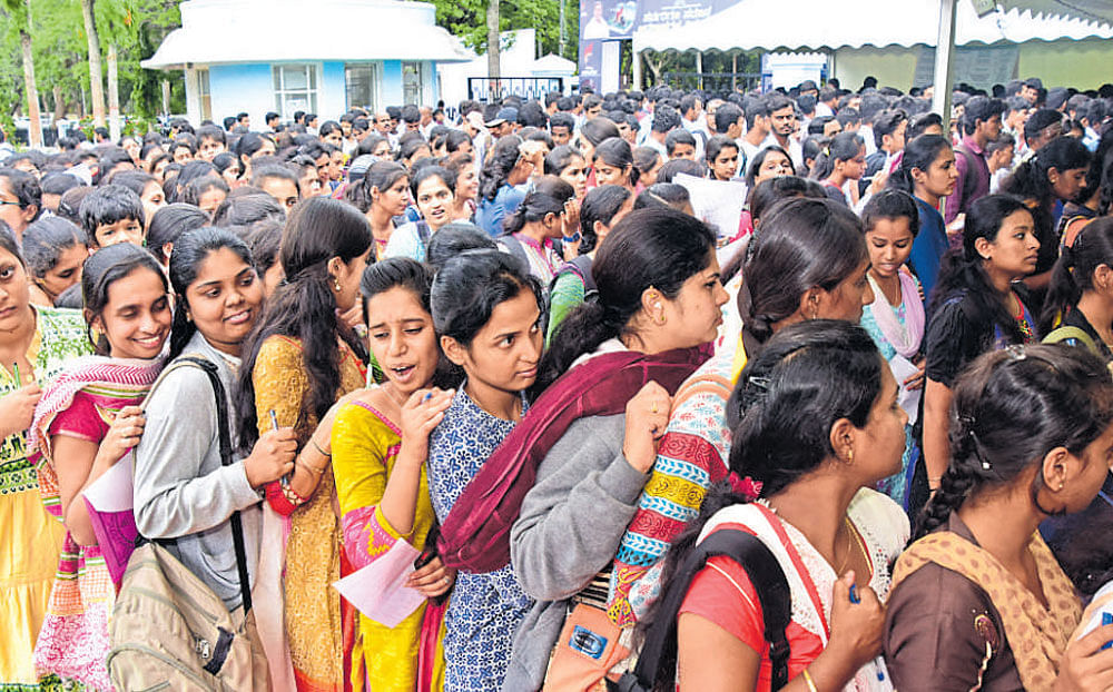 Job aspirants during a job fair organised by the Department of Skill Development and Entrepreneurship and Livelihood in Mysuru recently. Dh File Photo
