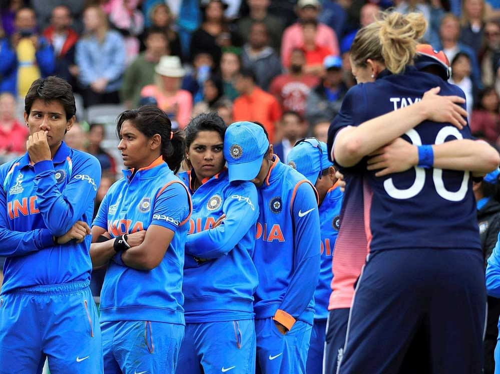 India players stand dejected prior to receiving their runners-up medals after losing the CC Women's World Cup final match against England, at Lord's, in London, Sunday. AP/PTI