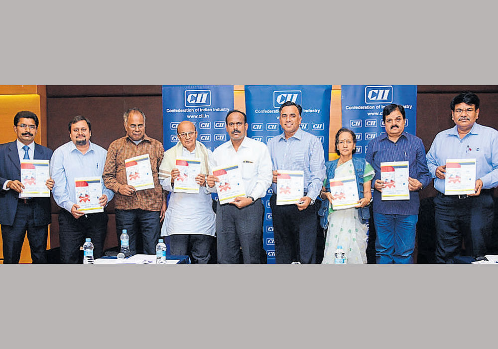 Assistant Labour Commissioner A C Thamanna released 'Corporate Compliance Handbook', in Mysuru recently. K Anantha Gowda; Neeraj Debey; V G K Nair, president of CITU; H V Anantha Subbarao, state president of AITUC; Arjun Ranga; Mangalamba Rao, vice president of BMS; S Sathyamurthy of INTUC and N Muthukumar are seen.